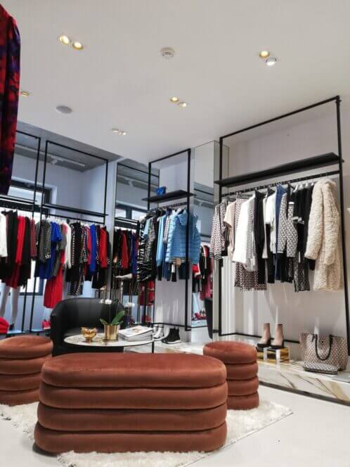 Clothing in store with couches