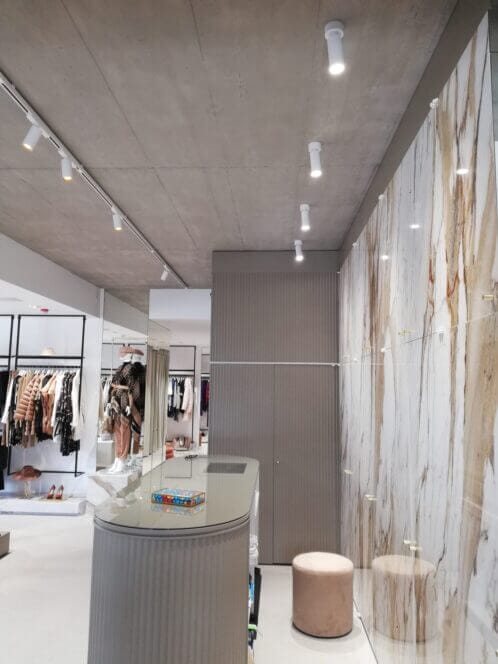 Counter at boutiquee with white spots and white, gold interior