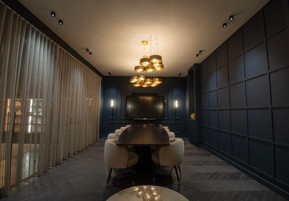 Luxurious meeting room with oval table, blue walls