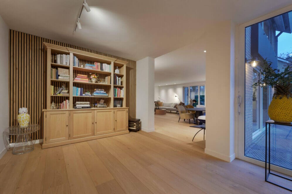 Book cabinet lit up by track spots