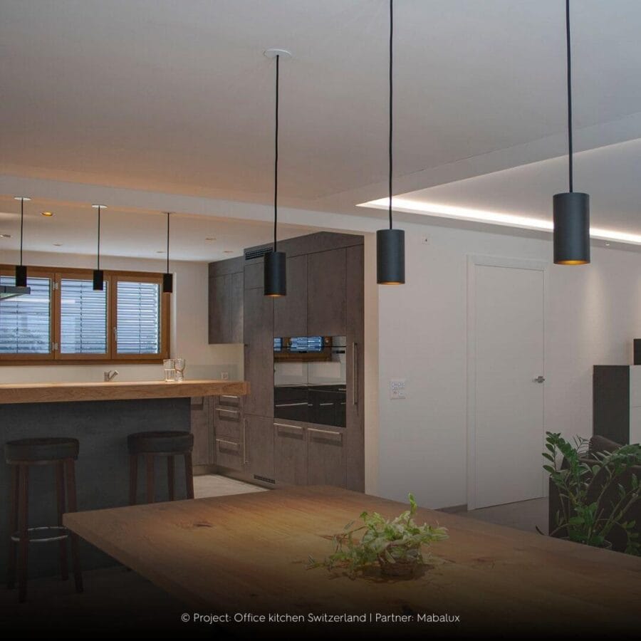 Dea Vesta tube luminaire in kitchen and dining area.
