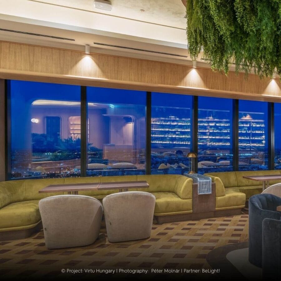 Dea Cura S lighting up with a clear beam above windows with a view over the city.