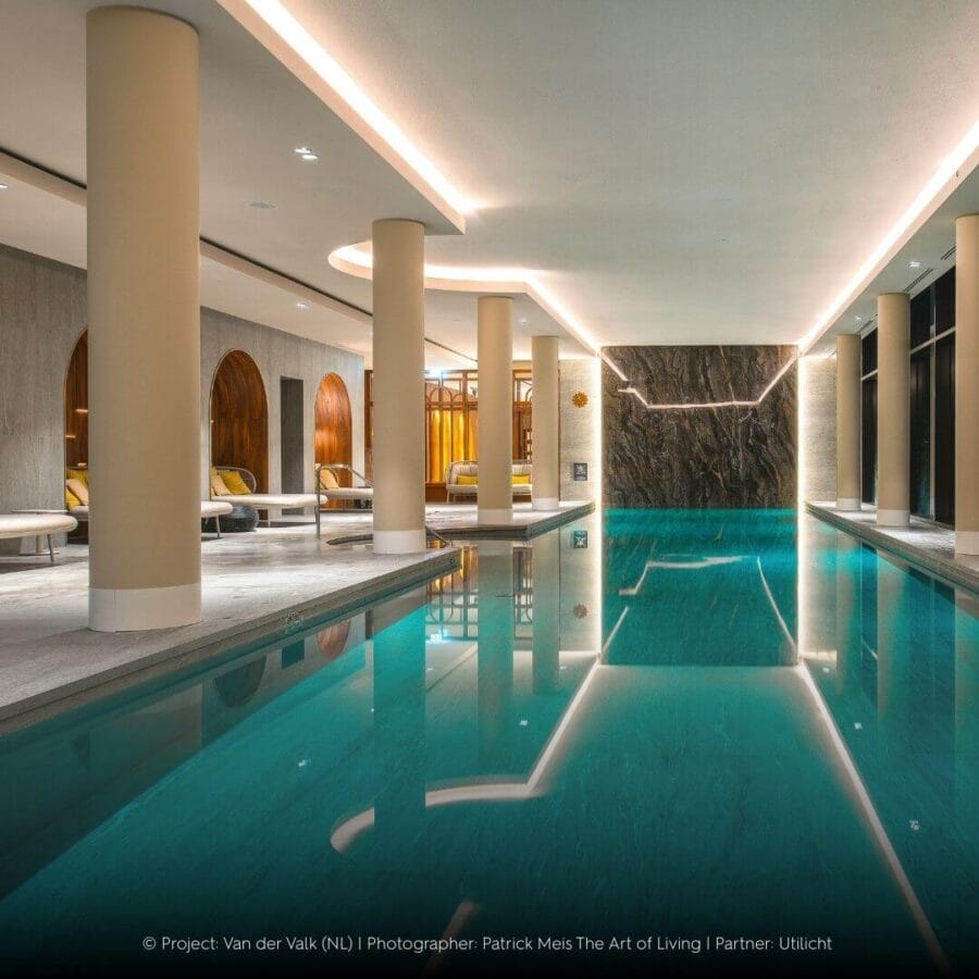 Indoor swimming pool of Van der Valk with round lines in the architecture and Karizma Luces Luna luminaires.