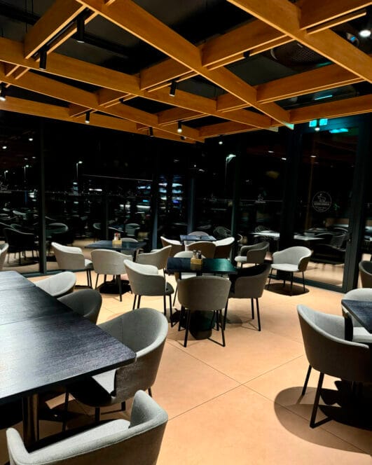 Restaurant by night with wooden ceiling