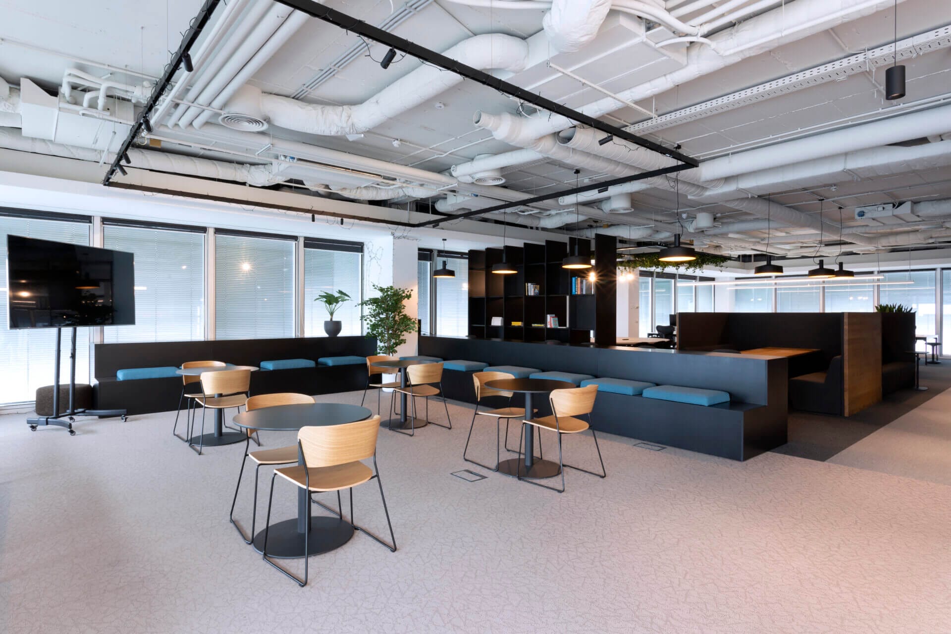 Cafeteria area office, industrial style, simple tables, track system